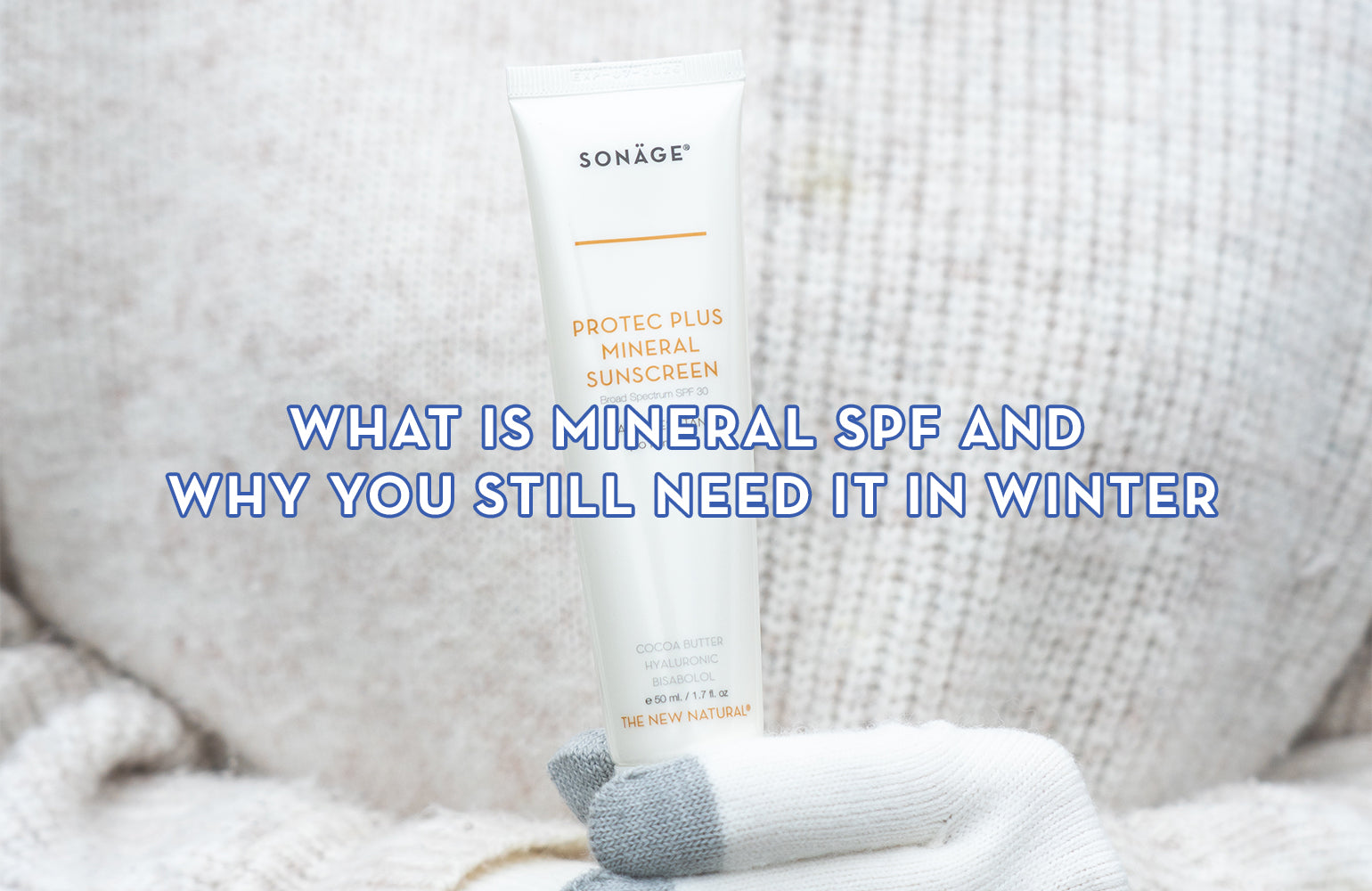 Person holding Protec Plus Mineral Sunscreen with SPF30 wearing white gloves and sweater