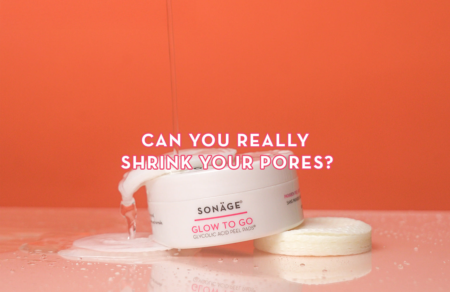 Glow to go packaging balancing on top of round pads with water pouring on top in front of orange background