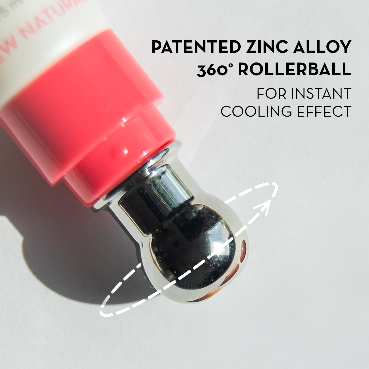 Close-up of a 360-degree rollerball with red cap and silver body on a light gray background, highlighting patented zinc alloy feature.