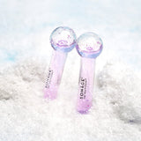 Mini Icy Globes Facial Massager in Snow on Blue Background